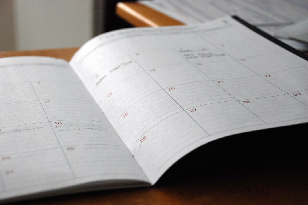 Open monthly planner on a wooden table