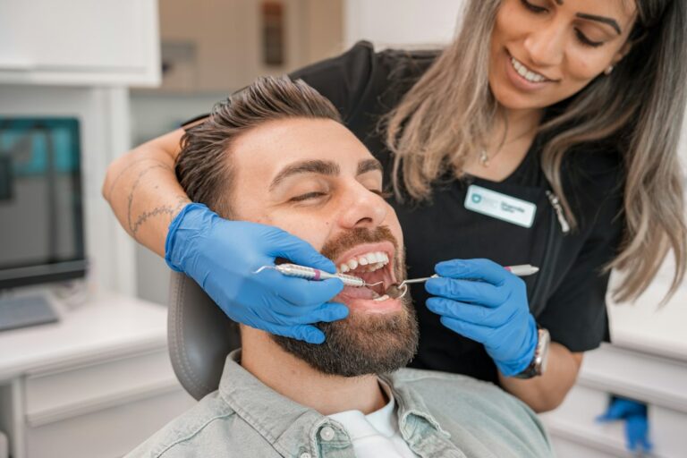 Illustrative image of a dental examination with a mirror.